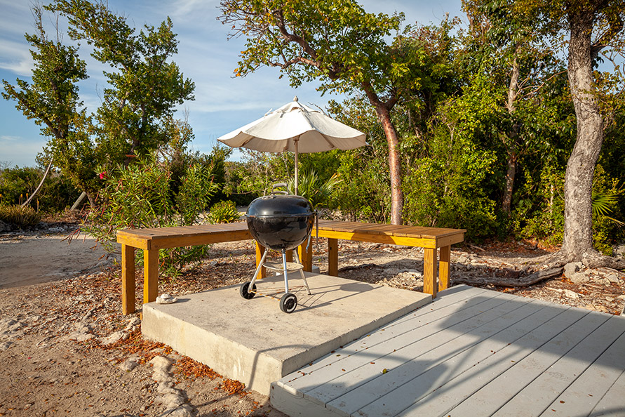New! Grilling station with umbrella is ideal for serving up the catch of the day.