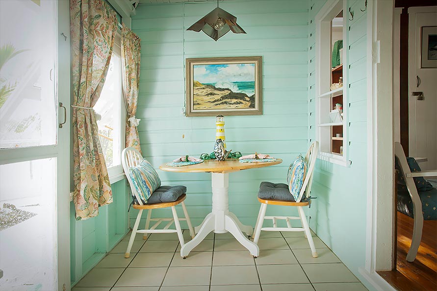 Screen porch is wonderfully cool and breezy, ideal for dining and/or family board games.