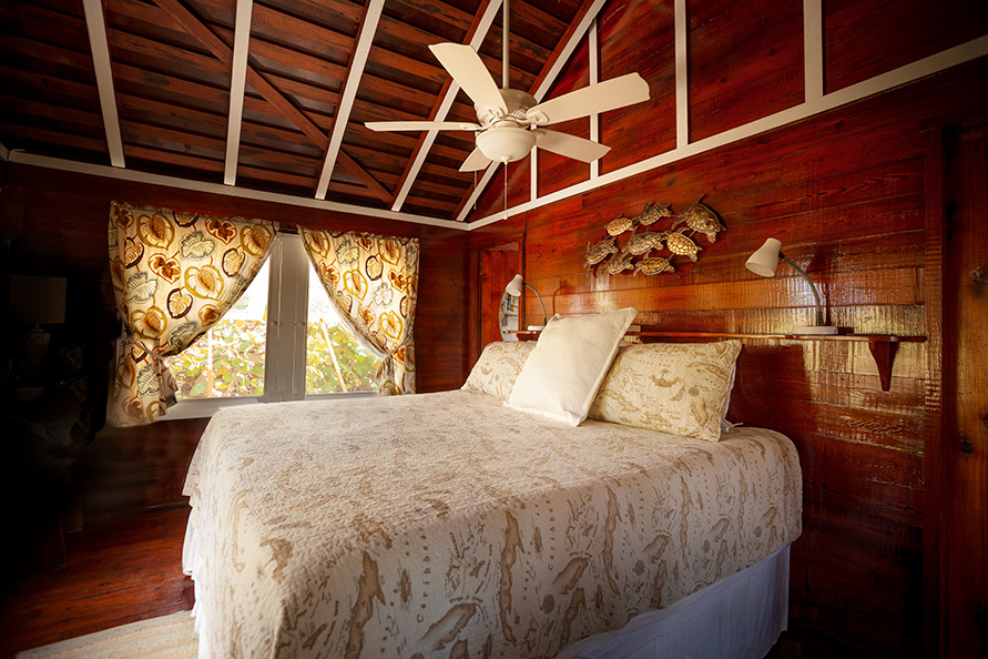 The front bedroom features a comfortable king bed and ceiling fan!