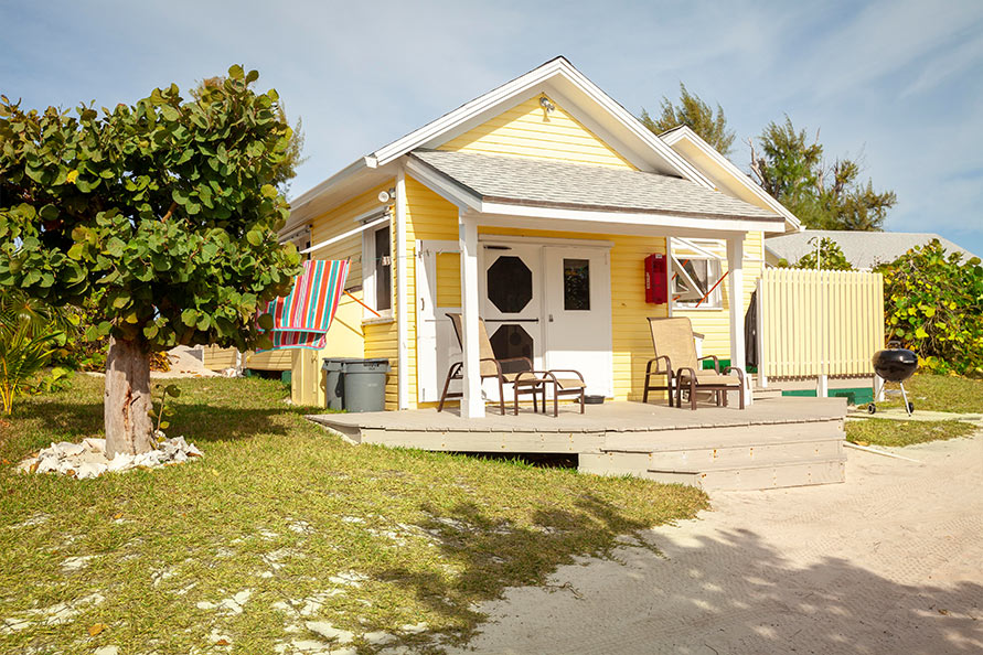 The south side of Palmetto features sunning deck and chairs just off the kitchen entry.