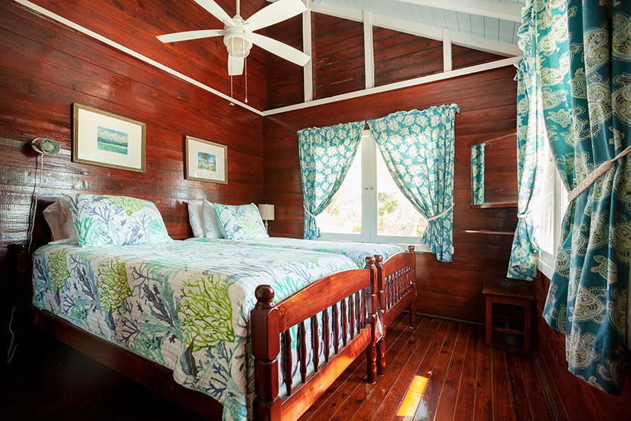 Second cottage bedroom with two twin beds.